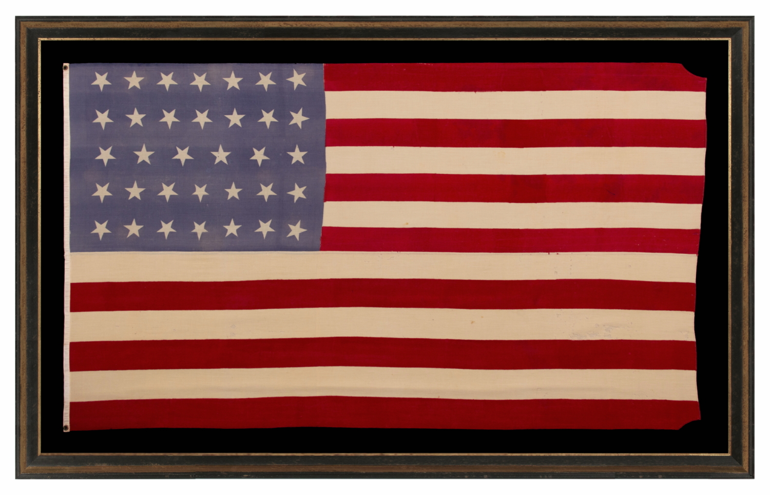 34 STAR MERINO WOOL FLAG OF THE CIVIL WAR PERIOD, WITH ITS STARS ORIENTED IN VARIOUS DIRECTIONS ON A PERIWINKLE BLUE CANTON; HIGHLY UNUSUAL; REFLECTS THE ADDITION OF KANSAS TO THE UNION AS A FREE STATE, circa 1861-1863
