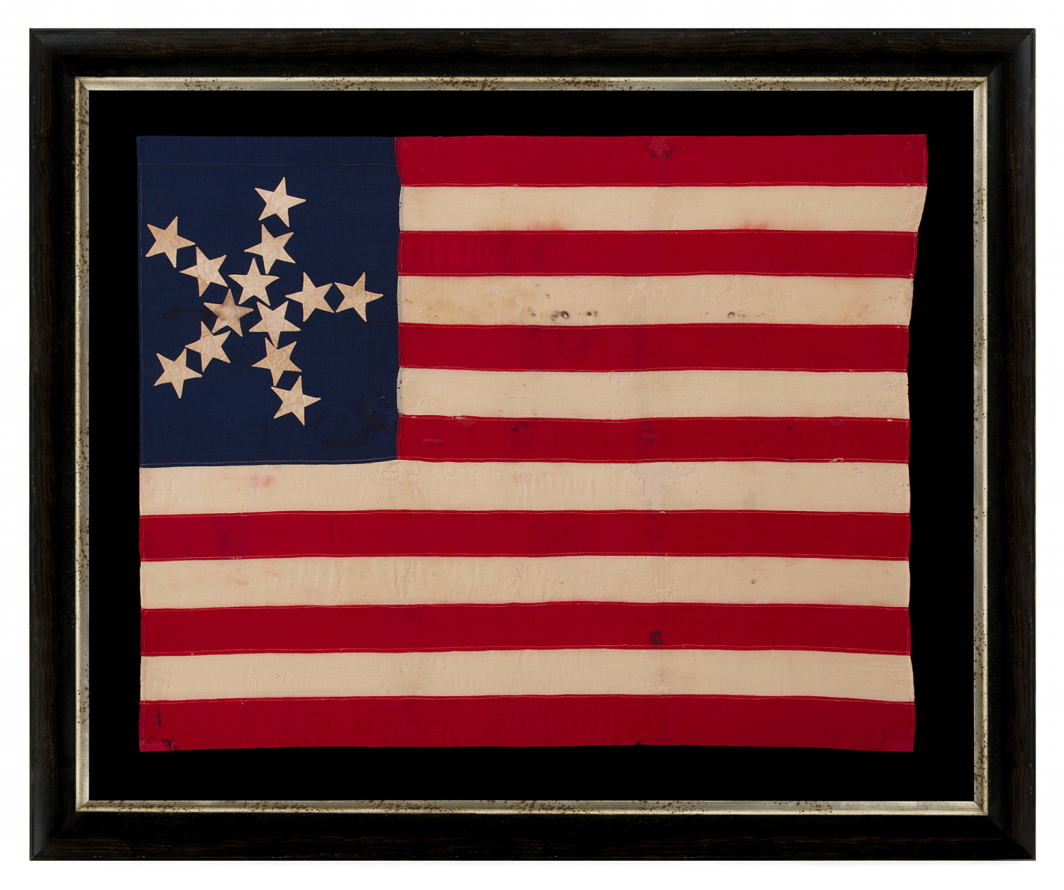 ANTIQUE AMERICAN FLAG OF THE CIVIL WAR PERIOD, WITH 13 STARS IN A "PINWHEEL GREAT STAR," A MASTERPIECE OF EARLY AMERICAN FLAG-MAKING