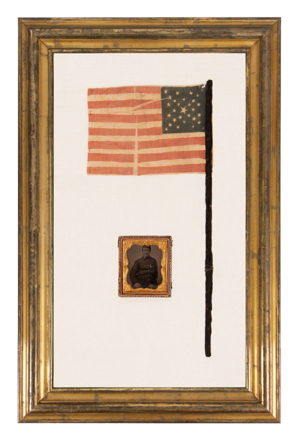 29 STARS IN A SPECTACULAR CROSS OR STARBURST MEDALLION, ONE OF JUST TWO KNOWN EXAMPLES IN THIS STYLE, PRE-CIVIL WAR, 1846-48, MEXICAN WAR PERIOD, REFLECTS THE ADDITION OF IOWA AS THE 29TH STATE; FORMERLY AMONG THE POSSESSIONS OF CORPORAL NATHANIEL POWERS, COLOR BEARER IN THE 10TH MASSACHUSETTS VOLUNTEERS, WHO LOST HIS ARM AT THE BATTLE OF FAIR OAKS, VIRGINIA IN 1862; THE FLAG-ITS STAFF WRAPPED IN BLACK CREPE—IS REPORTED TO HAVE BEEN DISTRIBUTED TO MOURNERS IN THE STREETS OF WASHINGTON, DC, ON 