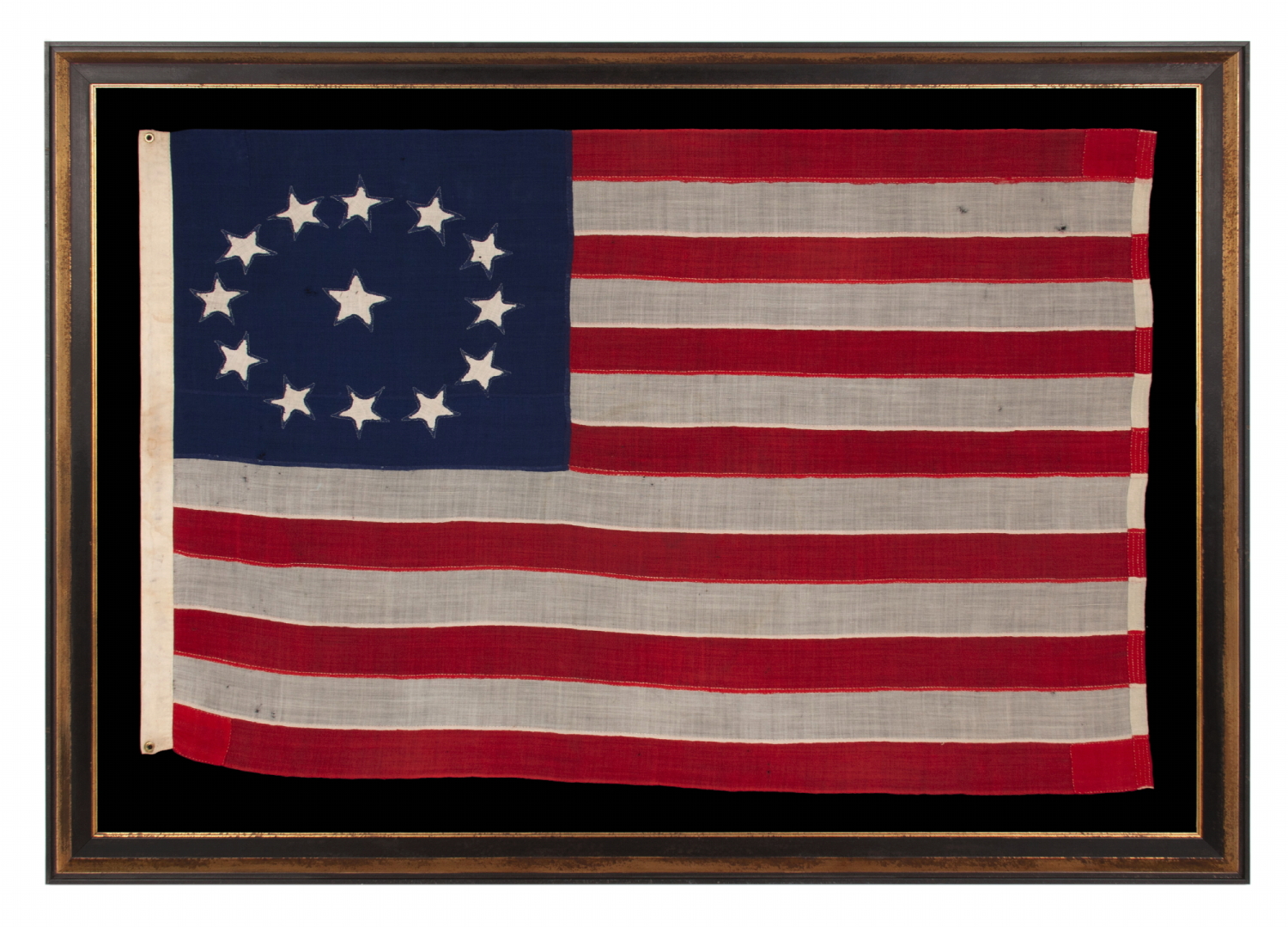 ENTIRELY HAND-SEWN ANTIQUE AMERICAN FLAG OF THE CIVIL WAR PERIOD, WITH 13 SINGLE-APPLIQUED STARS IN A BEAUTIFUL, OVAL ARRANGEMENT OF WHAT IS KNOWN AS THE 3RD MARYLAND PATTERN, MADE SOMETIME BETWEEN THE 1850’s AND THE CIVIL WAR (1861-65)