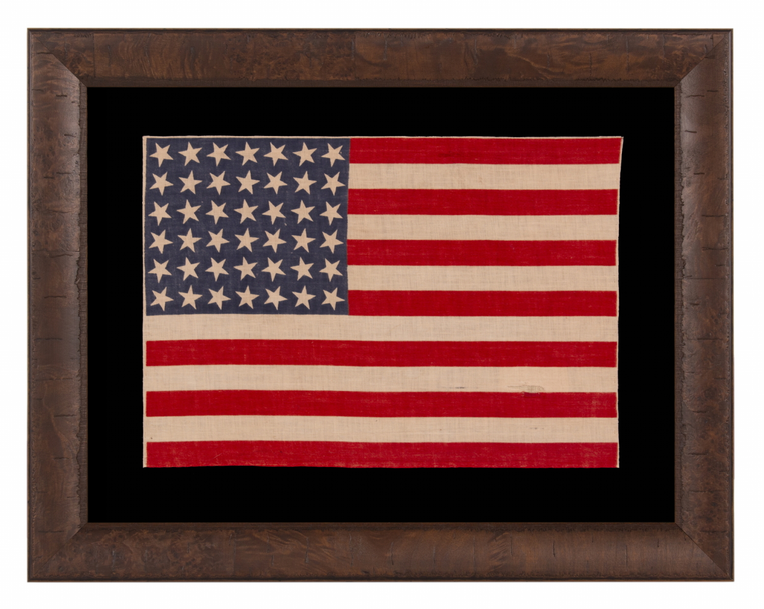 42 STARS ON AN ANTIQUE AMERICAN FLAG WITH SCATTERED STAR POSITIONING, REFLECTS THE ADDITION OF WASHINGTON STATE, MONTANA, AND THE DAKOTAS, NEVER AN OFFICIAL STAR COUNT, circa 1889-1890