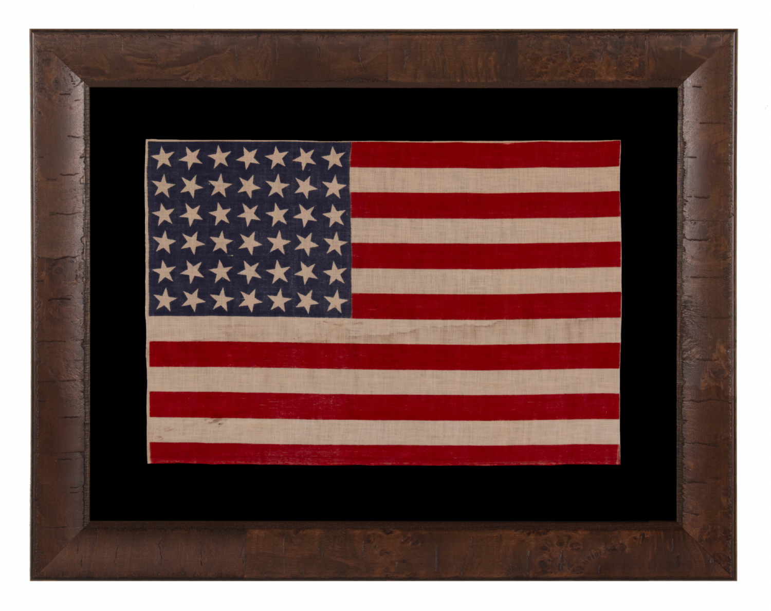 42 STARS ON AN ANTIQUE AMERICAN FLAG WITH SCATTERED STAR POSITIONING, REFLECTS THE ADDITION OF WASHINGTON STATE, MONTANA, AND THE DAKOTAS, NEVER AN OFFICIAL STAR COUNT, circa 1889-1890