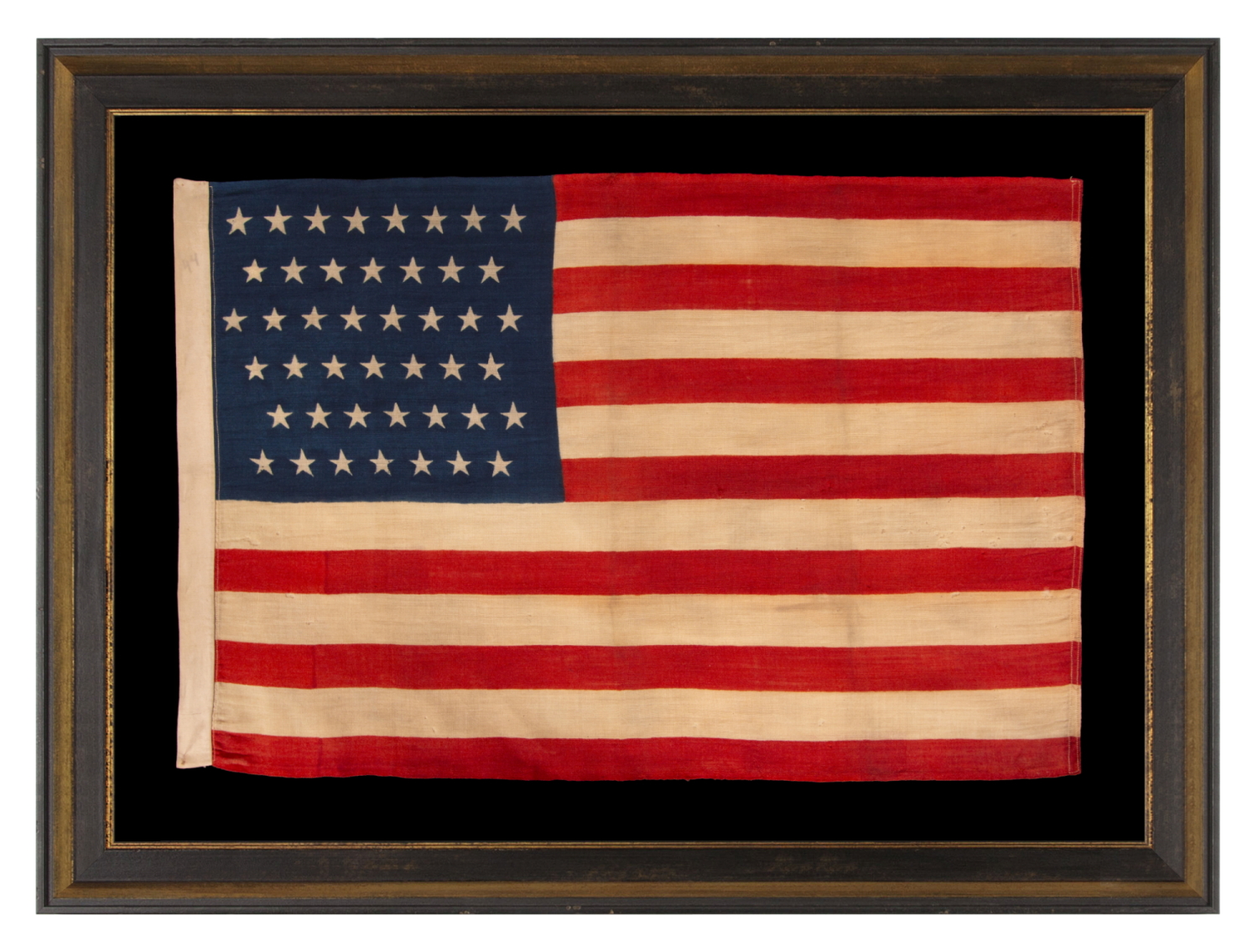 44 STARS IN ZIGZAGGING ROWS ON A PRESS-DYED WOOL AMERICAN FLAG MADE BY THE HORSTMANN COMPANY IN PHILADELPHIA, REFLECTS THE PERIOD WHEN WYOMING WAS THE MOST RECENT STATE TO JOIN THE UNION, 1890-1896