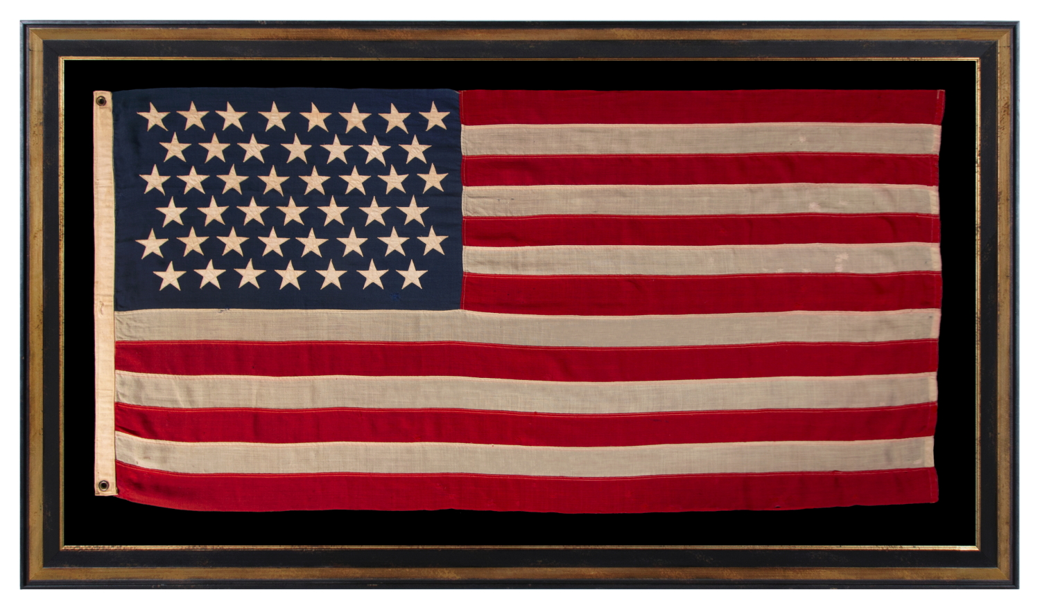 45 STARS ON AN ANTIQUE AMERICAN FLAG OF THE 1896-1908 ERA, REFLECTS THE ADDITION OF UTAH AS THE 45TH STATE; SPANISH-AMERICAN WAR ERA; AN ESPECIALLY BEAUTIFUL EXAMPLE WITH LARGER STARS THAN MOST AND EXCEPTIONAL, TRADITIONAL SHADES OF SCARLET RED AND NAVY