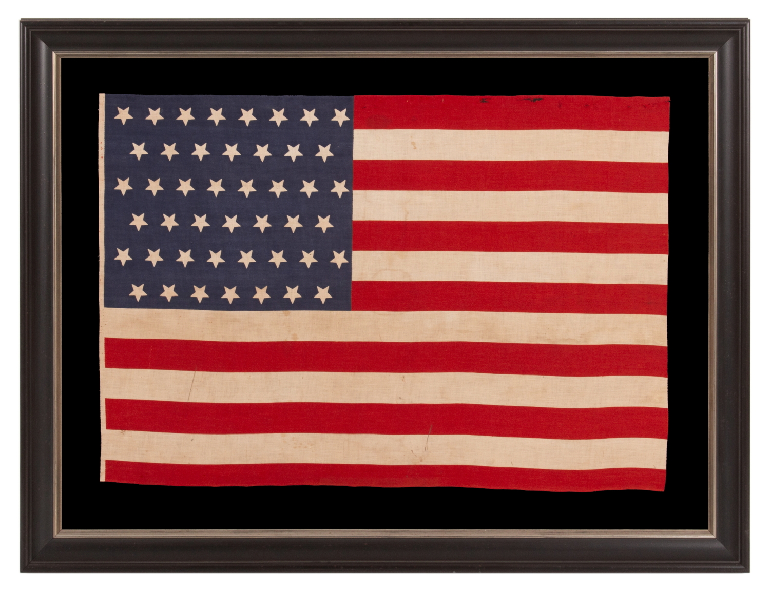 45 UPSIDE-DOWN STARS ON AN ANTIQUE AMERICAN FLAG MADE IN THE ERA OF THE SPANISH-AMERICAN WAR (1898), WHEN UTAH WAS THE MOST RECENT STATE TO JOIN THE UNION, circa 1896-1908