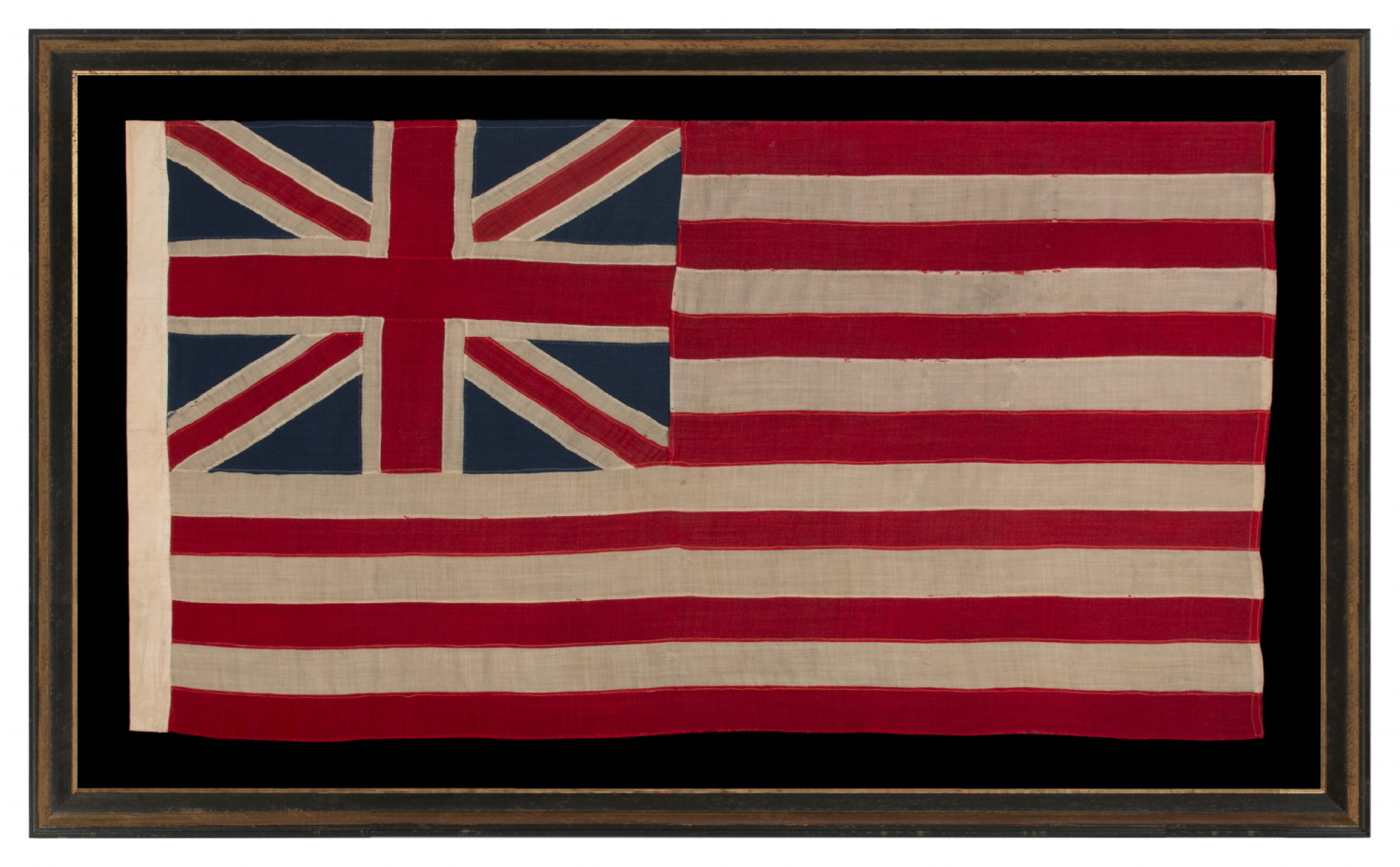 EXTRAORDINARILY RARE, 1876 EXAMPLE OF THE FIRST NATIONAL FLAG OF AMERICA, THE “GRAND UNION” OR “CONTINENTAL COLORS,” MADE TO CELEBRATE THE 100TH ANNIVERSARY OF AMERICAN INDEPENDENCE, ALMOST CERTAINLY FOR DISPLAY AT THE CENTENNIAL INTERNATIONAL EXHIBITION IN PHILADELPHIA