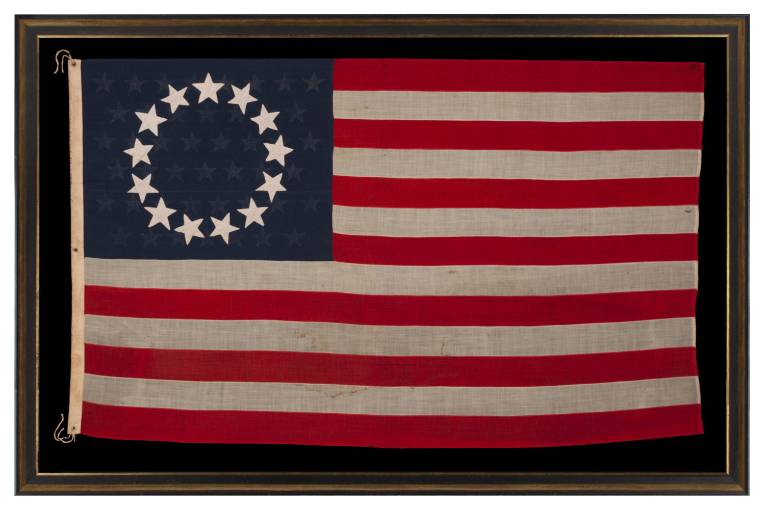 13 STARS IN THE BETSY ROSS PATTERN, WITH 45 STARS ON THE REVERSE; ON AN ANTIQUE AMERICAN FLAG MADE AND SIGNED BY A PREVIOUSLY UNIDENTIFIED FLAG-MAKER, ANNIE MAC LACHLAN OF JERSEY CITY, NEW JERSEY, circa 1896-1908; A RARE AND INTERESTING EXAMPLE, IN A LARGE SCALE AMONG EARLY 13 STAR FLAGS IN THIS DESIGN