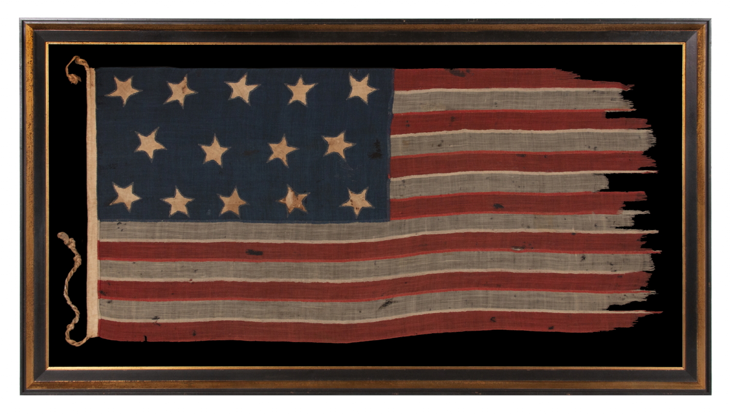 EXTREMELY RARE 14-STAR, 13-STRIPE FLAG, LIKELY MADE DURING THE ANTEBELLUM WITH AN ABOLITIONIST MESSAGE, ENTIRELY HAND-SEWN AND WITH ENDEARING WEAR FROM OBVIOUS USE, POSSIBLY OF U.S. NAVY ORIGIN, circa 1846-1848; EXHIBITED JUNE- SEPTEMBER, 2021 AT THE MUSEUM OF THE AMERICAN REVOLUTION
