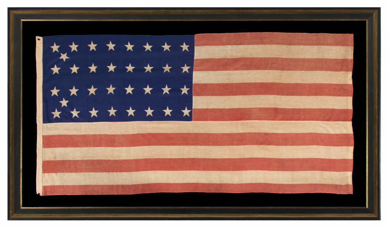 34 STAR ANTIQUE AMERICAN FLAG OF THE CIVIL WAR PERIOD (1861-63), WITH WOVEN STRIPES, PRESS-DYED STARS, AND BEAUTIFUL COLORS, POSSIBLY MADE IN NEW YORK BY THE ANNIN COMPANY, REFLECTS THE ADDITION OF KANSAS TO THE UNION, 1861-1863