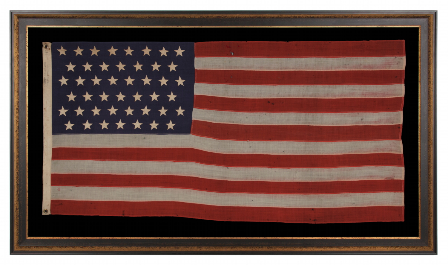 45 STAR ANTIQUE AMERICAN FLAG, MARKED "U.S. ARMY STANDARD BUNTING,” SPANISH-AMERICAN WAR ERA, REFLECTS THE ADDITION OF UTAH AS THE 45TH STATE, 1896-1907