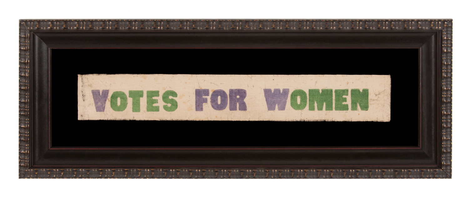 VOTES FOR WOMEN PARADE TEXTILE IN PURPLE AND GREEN, OF A TYPE WORN AS SASHES AND WAVED AS NARROW PARADE FLAGS OR BANNERS, MADE IN HARTFORD, CONNECTICUT BY CALHOUN PRESS FOR THE WOMEN'S POLITICAL UNION OF NEW YORK, CONNECTICUT, AND NEW JERSEY, ORGANIZED BY CARRIE STANTON'S DAUGHTER, HARRIOT EATON STANTON BLATCH, 1910-1915