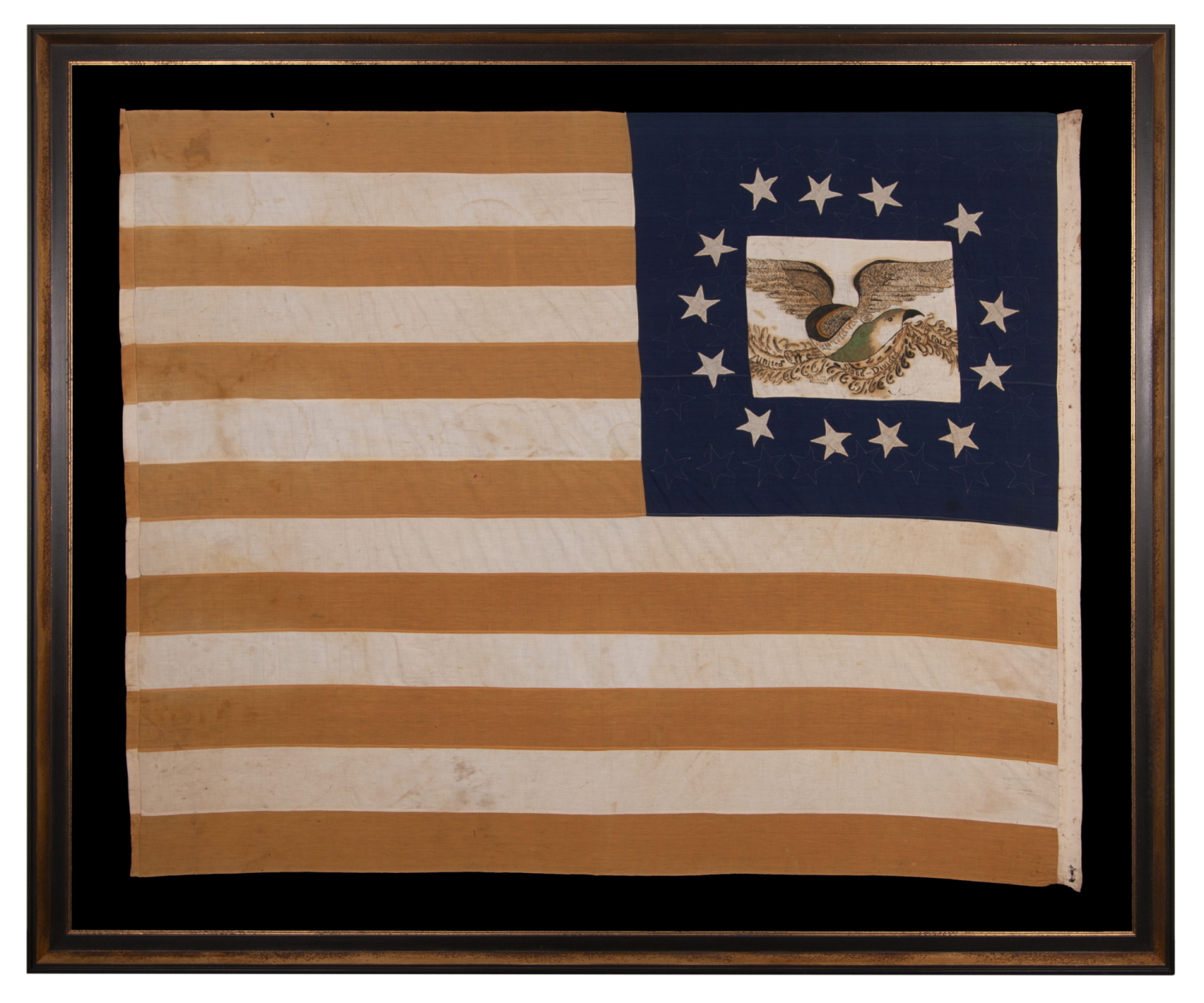 13 STARS IN A LOPSIDED, OVAL WREATH, SURROUNDING A HAND-PAINTED EAGLE, WITH A GARLAND-LADEN STREAMER THAT READS: "UNITED WE STAND, DIVIDED WE FALL", ON A HOMEMADE, ANTIQUE AMERICAN FLAG WITH 44 STARS ON THE OPPOSING SIDE; MADE IN KANSAS, LINKED TO TWO ILLINOIS, UNION ARMY VETERANS; REFLECTS THE PERIOD WHEN WYOMING WAS THE MOST RECENT STATE TO JOIN THE UNION, 1890-1896