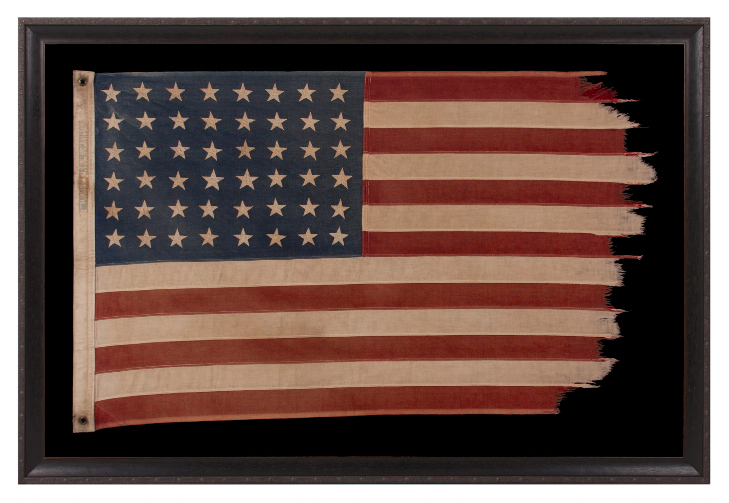 48 STAR ANTIQUE AMERICAN FLAG OF THE 1912-1918 ERA, LIKELY A U.S. NAVY SMALL BOAT ENSIGN, PRODUCED FOR U.S. INVOLVEMENT IN WWI (1917-18); THE EARLIEST IDENTIFIED EXAMPLE OF ANY KIND FROM PROMINENT U.S. FLAG-MAKER JOHN C. DETTRA, THE FIRM OF WHICH PRACTICALLY NEVER SIGNED FLAGS UNTIL POST-WWII (1945 & AFTER)