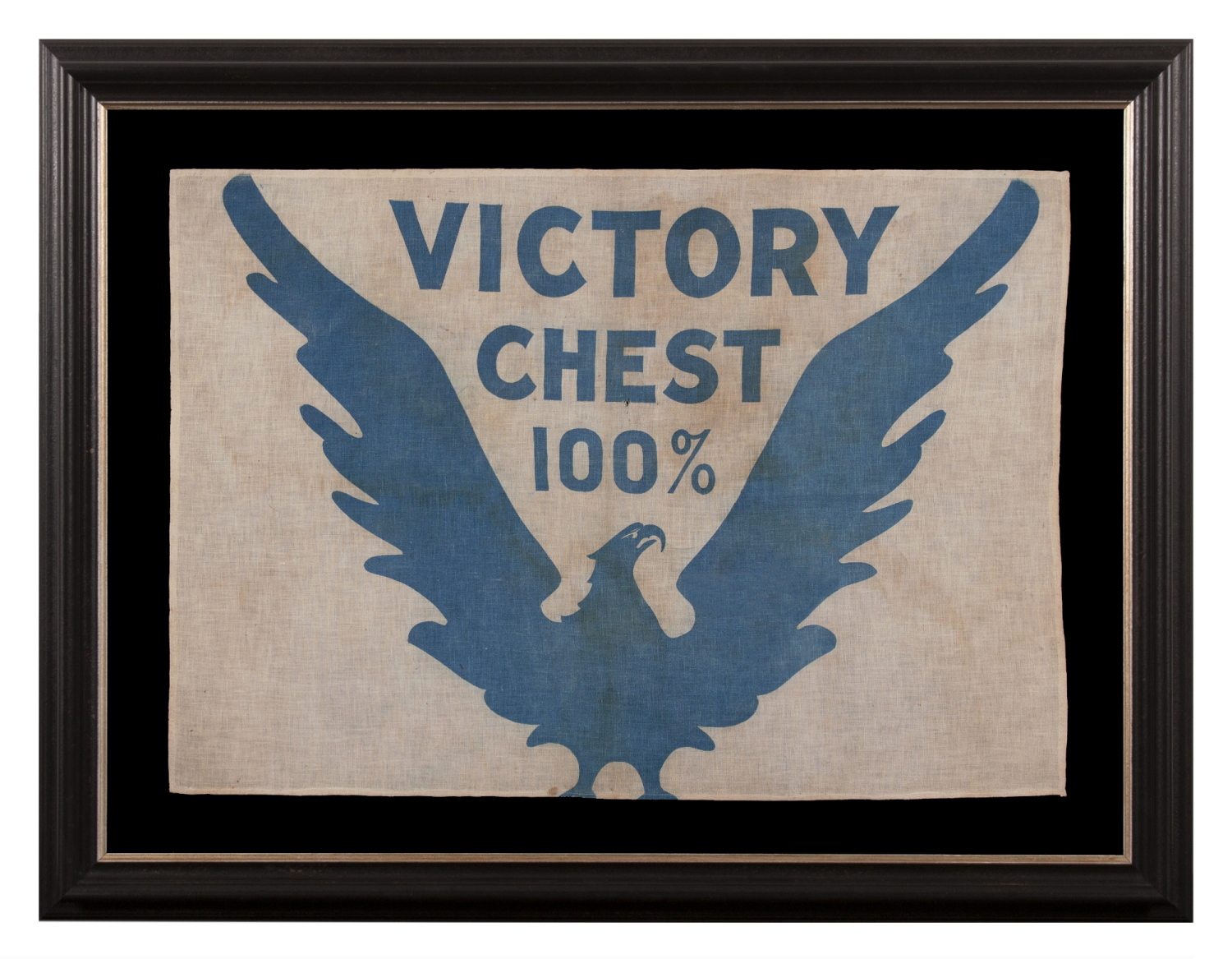 WWI BOND DRIVE FLAG WITH A WHIMSICAL & ARTISTICALLY COMPELLING EAGLE, PERCHED DIRECTLY ON THE LOWER EDGE OF THE TEXTILE, WITH WINGS UPSTRETCHED IN A “V” FOR “VICTORY,” CRADLING THE SLOGAN: “VICTORY CHEST 100%;” PRUSSIAN BLUE ON A WHITE GROUND; LIKELY MADE FOR THE 5th BOND SUBSCRIPTION, ISSUED MAY 20th, 1919