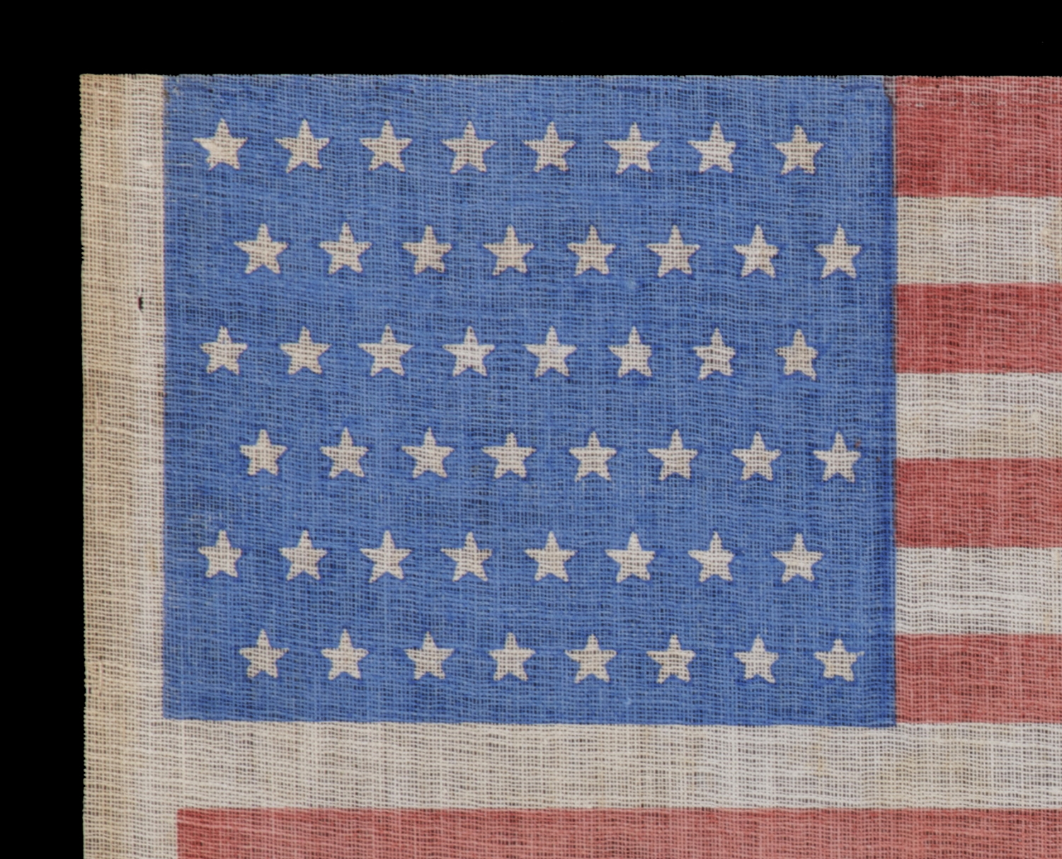 48 STARS IN STAGGERED ROWS ON AN ANTIQUE AMERICAN FLAG WITH A BRILLIANT ...