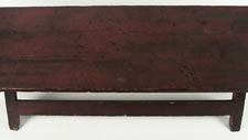 SAWBUCK BENCH IN RED OVER GREEN PAINT WITH TREMENDOUS EARLY SURFACE, CIRCA 1880, NEW BEDFORD, MASSACHUSETTS: