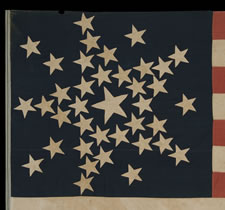 SPECTACULAR 38 STAR FLAG WITH A VERY RARE VARIATION OF THE "GREAT STAR" CONFIGURATION THAT HAS ADDITIONAL STARS BETWEEN EACH ARM, COLORADO STATEHOOD, 1876-1889