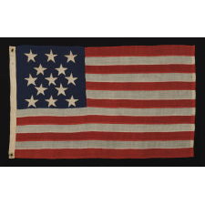 13 HAND-SEWN, SINGLE-APPLIQUÉD STARS, LIKELY MADE BY ANNIN & CO. IN NEW YORK CITY, IN A RARE, SMALL SIZE AMONG KNOWN FLAGS WITH SEWN CONSTRUCTION, 1861-1876 ERA, PROBABLY DESIGNED FOR USE AS A CAMP COLORS OR IN SOME OTHER MILITARY FUNCTION