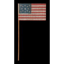 13 STAR ANTIQUE AMERICAN FLAG WITH A MEDALLION CONFIGURATION OF STARS, MADE FOR THE 1876 CENTENNIAL CELEBRATION