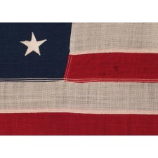 13 STAR ANTIQUE AMERICAN FLAG WITH A 3-2-3-2-3 CONFIGURATION OF STARS; A SMALL-SCALE EXAMPLE, MADE CIRCA 1895-1926