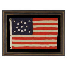 13 STAR ANTIQUE AMERICAN FLAG WITH A MEDALLION CONFIGURATION OF STARS; A SMALL-SCALE EXAMPLE, MADE circa 1895-1926
