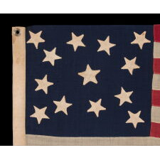 13 STAR ANTIQUE AMERICAN FLAG WITH AN ATTRACTIVE & WHIMSICAL PRESENTATION OF THE MEDALLION CONFIGURATION; A SMALL-SCALE EXAMPLE, LAST DECADE 19th CENTURY