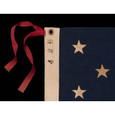 13 STAR ANTIQUE AMERICAN FLAG WITH A 3-2-3-2-3 CONFIGURATION AND AN INK-STAMPED MARK OF THE NEW ENGLAND DECORATING COMPANY OF MASSACHUSETTS, WITH HAND-SEWN, TWILL TAPE TIES, MADE IN THE LAST DECADE OF THE 19TH CENTURY, circa 1892-1899