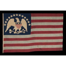 13 STAR ANTIQUE AMERICAN FLAG WITH A BROAD, ARCHED FORMATION OF HAND-SEWN, SINGLE-APPLIQUÉD STARS, ARCH ABOVE A BEAUTIFULLY HAND-SEWN FEDERAL EAGLE, ATTRIBUTED TO FLAG-MAKER SARAH McFADDEN – “NEW YORK’S BETSY ROSS” – AT 198 HUDSON STREET IN MANHATTAN, circa 1870-1880; EXHIBITED AT THE MUSEUM OF THE AMERICAN REVOLUTION FROM JUNE – JULY, 2019