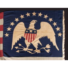 13 STAR ANTIQUE AMERICAN FLAG WITH A BROAD, ARCHED FORMATION OF HAND-SEWN, SINGLE-APPLIQUÉD STARS, ARCH ABOVE A BEAUTIFULLY HAND-SEWN FEDERAL EAGLE, ATTRIBUTED TO FLAG-MAKER SARAH McFADDEN – “NEW YORK’S BETSY ROSS” – AT 198 HUDSON STREET IN MANHATTAN, circa 1870-1880; EXHIBITED AT THE MUSEUM OF THE AMERICAN REVOLUTION FROM JUNE – JULY, 2019