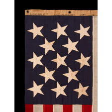 13 STAR ANTIQUE AMERICAN FLAG w/ A 3-2-3-2-3 PATTERN OF ESPECIALLY LARGE STARS; A U.S. NAVY SMALL BOAT ENSIGN, SIGNED & DATED 1903, MADE AT THE BROOKLYN NAVY YARD IN NEW YORK CITY