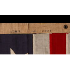 13 STAR ANTIQUE AMERICAN FLAG w/ A 3-2-3-2-3 PATTERN OF ESPECIALLY LARGE STARS; A U.S. NAVY SMALL BOAT ENSIGN, SIGNED & DATED 1903, MADE AT THE BROOKLYN NAVY YARD IN NEW YORK CITY