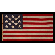 13 STAR ANTIQUE AMERICAN FLAG w/ A 3-2-3-2-3 PATTERN OF ESPECIALLY LARGE STARS; A U.S. NAVY SMALL BOAT ENSIGN, SIGNED & DATED 1903, MADE AT THE BROOKLYN NAVY YARD IN NEW YORK CITY