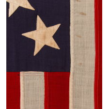 13 STAR ANTIQUE AMERICAN FLAG w/ A 3-2-3-2-3 PATTERN OF ESPECIALLY LARGE STARS; A U.S. NAVY SMALL BOAT ENSIGN, SIGNED & DATED 1903, MADE AT THE BROOKLYN NAVY YARD IN NEW YORK CITY