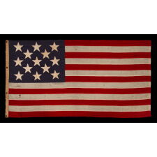 13 STAR ANTIQUE AMERICAN FLAG w/ A 3-2-3-2-3 PATTERN OF ESPECIALLY LARGE STARS; A U.S. NAVY SMALL BOAT ENSIGN, SIGNED & DATED 1903, MADE AT THE BROOKLYN NAVY YARD IN NEW YORK CITY