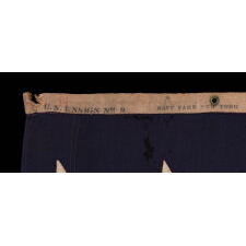 13 STAR ANTIQUE AMERICAN FLAG WITH A 3-2-3-2-3 PATTERN OF ESPECIALLY LARGE STARS; A U.S. NAVY SMALL BOAT ENSIGN, SIGNED & DATED 1914, MADE AT THE BROOKLYN NAVY YARD IN NEW YORK CITY