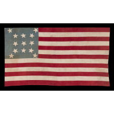 13 STAR ANTIQUE AMERICAN FLAG, A HOMEMADE EXAMPLE WITH AN INCREDIBLY RARE CONFIGURATION OF STARS THAT CONSISTS OF A BOX OF 9 WITH 4 OUTLIERS, SET AGAINST A LIGHT BLUE CANTON; LIKELY MADE IN CELEBRATION OF THE 1876 CENTENNIAL OF AMERICAN INDEPENDENCE; EXHIBITED AT THE MUSEUM OF THE AMERICAN REVOLUTION, JUNE-JULY 2019