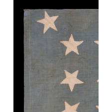 13 STAR ANTIQUE AMERICAN FLAG, A HOMEMADE EXAMPLE WITH AN INCREDIBLY RARE CONFIGURATION OF STARS THAT CONSISTS OF A BOX OF 9 WITH 4 OUTLIERS, SET AGAINST A LIGHT BLUE CANTON; LIKELY MADE IN CELEBRATION OF THE 1876 CENTENNIAL OF AMERICAN INDEPENDENCE; EXHIBITED AT THE MUSEUM OF THE AMERICAN REVOLUTION, JUNE-JULY 2019
