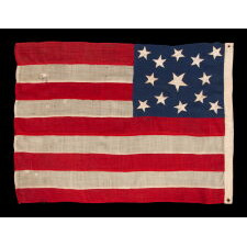 13 STAR ANTIQUE AMERICAN FLAG OF THE CIVIL WAR PERIOD (1861-1865), WITH 9 STRIPES TO REFLECT THE OMISSION OF NORTH & SOUTH CAROLINA, GEORGIA, & VIRGINIA, THE 4 SLAVE STATES AMONG THE ORIGINAL 13 COLONIES THAT SECEDED FROM THE UNION, WITH ITS CANTON RESTING ON THE WAR STRIPE, STRIKING COLOR, AND A BEAUTIFUL MEDALLION CONFIGURATION