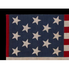 13 STAR ANTIQUE AMERICAN PARADE FLAG, WITH A 3-2-3-2-3 CONFIGURATION OF STARS, AN EXTREMELY SCARCE AND UNUSUALLY LARGE VARIETY, MADE circa 1876-1899