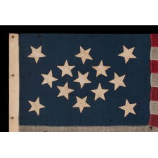 13 STAR FLAG OF THE CIVIL WAR PERIOD, WITH A DIAMOND SHAPED CONFIGURATION OF STARS; ONE OF JUST TWO EARLY EXAMPLES OF THE STARS & STRIPES, WITH SEWN CONSTRUCTION, TO SHARE A VARIANT OF THIS EXTREMELY RARE DESIGN, circa 1863-1865