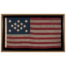 13 STAR FLAG OF THE CIVIL WAR PERIOD, WITH A DIAMOND SHAPED CONFIGURATION OF STARS; ONE OF JUST TWO EARLY EXAMPLES OF THE STARS & STRIPES, WITH SEWN CONSTRUCTION, TO SHARE A VARIANT OF THIS EXTREMELY RARE DESIGN, circa 1863-1865
