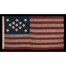 13 STAR FLAG OF THE CIVIL WAR PERIOD, WITH A DIAMOND SHAPED CONFIGURATION OF STARS; ONE OF JUST TWO EARLY EXAMPLES OF THE STARS & STRIPES, WITH SEWN CONSTRUCTION, TO SHARE A VARIANT OF THIS EXTREMELY RARE DESIGN, circa 1863-1865