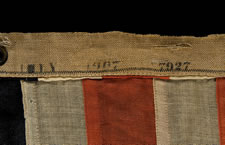 13 STAR U.S. NAVY SMALL BOAT ENSIGN MADE AT THE BROOKLYN NAVY YARD, NEW YORK, DATED 1907, PROBABLY PRODUCED TO OUTFIT TEDDY ROOSEVELT'S GREAT WHITE FLEET
