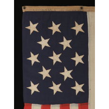 13 STAR U.S. NAVY SMALL BOAT ENSIGN MADE AT THE BROOKLYN NAVY YARD, NEW YORK, DATED 1907, PROBABLY PRODUCED TO OUTFIT TEDDY ROOSEVELT'S GREAT WHITE FLEET