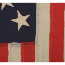 13 STAR U.S. NAVY SMALL BOAT ENSIGN MADE AT THE BROOKLYN NAVY YARD, NEW YORK, DATED 1907, PROBABLY PRODUCED TO OUTFIT TEDDY ROOSEVELT'S GREAT WHITE FLEET