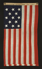 13 STARS, AN EXTRAORDINARILY SMALL U.S. NAVY SMALL BOAT ENSIGN, THE ONLY ONE I'VE EVER SEEN IN THIS SIZE, MARKED NAVY YARD, NEW YORK, 1904