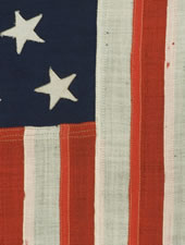 13 STARS, AN EXTRAORDINARILY SMALL U.S. NAVY SMALL BOAT ENSIGN, THE ONLY ONE I'VE EVER SEEN IN THIS SIZE, MARKED NAVY YARD, NEW YORK, 1904
