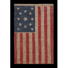13 STARS IN A MEDALLION PATTERN, ON AN ANTIQUE AMERICAN PARADE MADE FOR THE 1876 CENTENNIAL OF AMERICAN INDEPENDENCE, IN AN UNUSUALLY LARGE SIZE AMONG ITS COUNTERPARTS; FORMERLY IN THE MASTAI COLLECTION, MARKED IN THEIR TRADITIONAL FASHION
