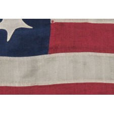 13 STARS IN A RARE TOMBSTONE PATTERN, OR PERHAPS A "U" FOR UNION, ON AN EXCEPTIONAL HAND-SEWN FLAG MADE ENTIRELY OF SILK, DATED JULY 4TH, 1865; ONE OF THE BEST THAT I HAVE EVER ENCOUNTERED