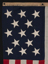 13 STARS U.S. NAVY SMALL BOAT ENSIGN, MADE AT THE BROOKLYN NAVY YARD IN NEW YORK CITY, DATED 1904